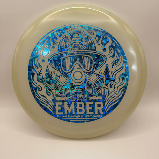 Glow-in-the-dark Lightspeed Ember Team Series disc with silver-blue foil stamp of firefighter mask and forest flames.